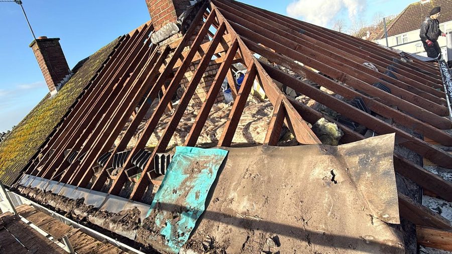 Original roof showing tired, mossy tiles before re-roof