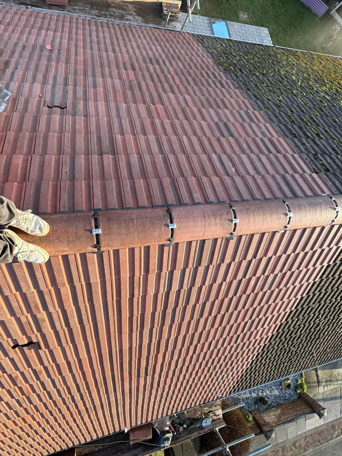 New tiles being laid up the slope
