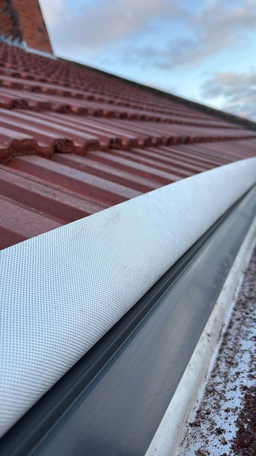 New guttering and leaf-guard fitted